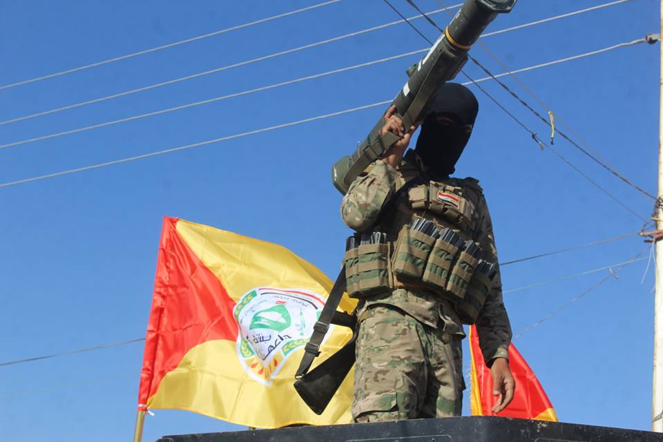 مقاتلون شيعة خلال مسيرة بمناسبة 